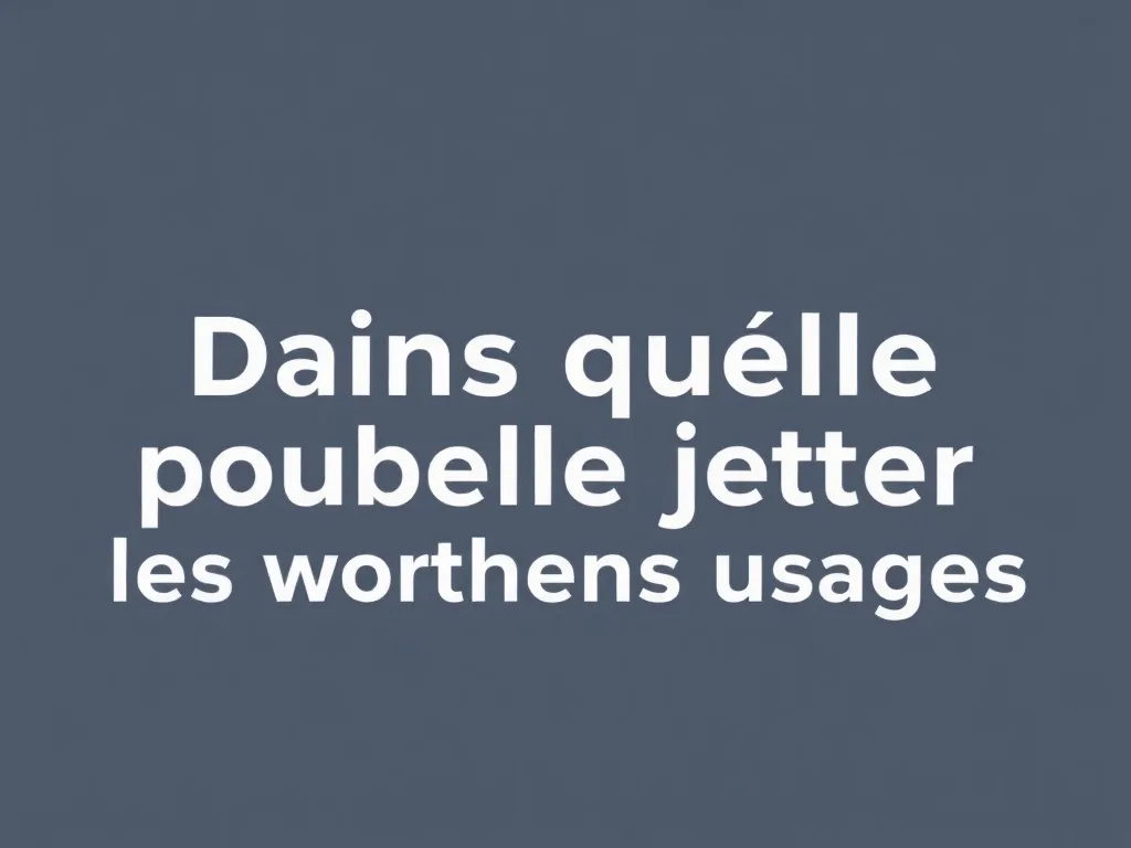 Un tas de vêtements usagés triés par couleur, à côté d'une borne de collecte textile.